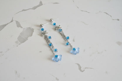 Elevate your everyday style with these enchanting butterfly earrings, featuring delicate silver chains, a charming bow accent, and sparkling crystal beads suspended from classic silver ball post studs. At approximately 3 inches in length, they offer the perfect balance of presence and wearability, making them ideal for both casual outings and special occasions. Weighing just 0.18 oz, these lightweight beauties won't weigh you down, allowing you to wear them comfortably all day long. The intricate design com