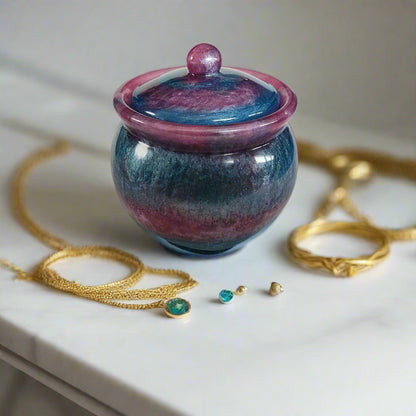 Store your treasures in this quirky Knickknack resin jar with lid. With a convenient size of 2.75 x 2.75 inches and a weight of 7.9 ounces, it's the perfect addition to your home decor. The 3.5-inch height and 2-inch depth make it both functional and stylish. Keep your items safe in style!

Resin Jar with lid

hand crafted with epoxy resin.