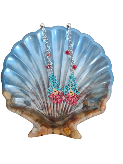 Inspire with our Filigree feather earrings. Made with stainless steel chains and delicate seed beads, these earrings feature intricate filigree feathers on ball post studs. Lightweight and elegant, perfect for any occasion. Elevate your style now!