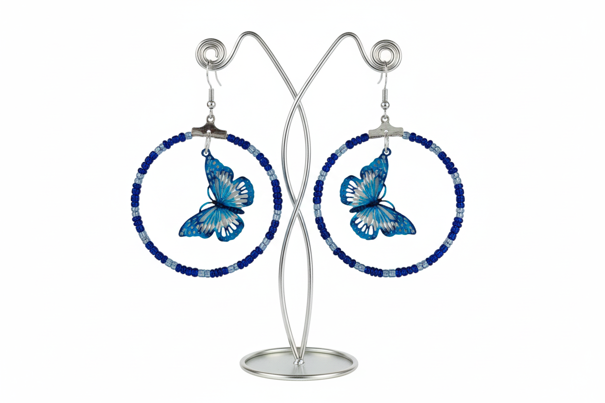Add a touch of whimsy and elegance to your look with our Silver hoop earrings adorned with delicate seed beads and a beautiful filigree butterfly charm. These versatile earrings can take you from day to night, elevating any outfit with their unique design and stunning details. A must-have for any jewelry collection!