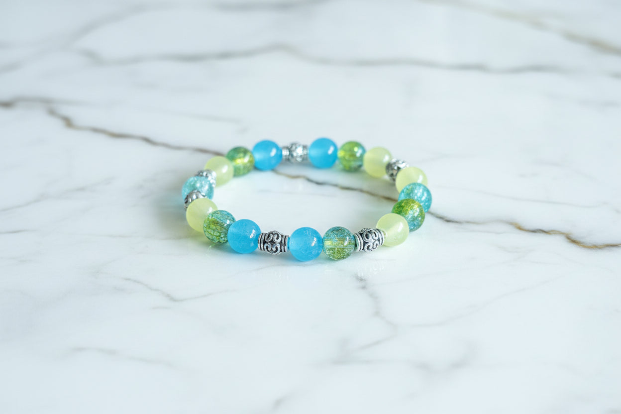 Bracelet - Medium 7.5 inches Elastic 8mm glass beads with silver metal spacer beads