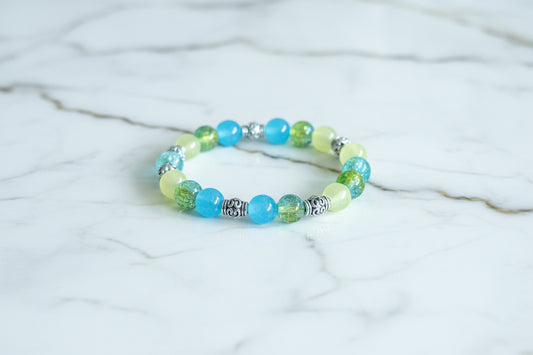 Bracelet - Medium 7.5 inches Elastic 8mm glass beads with silver metal spacer beads