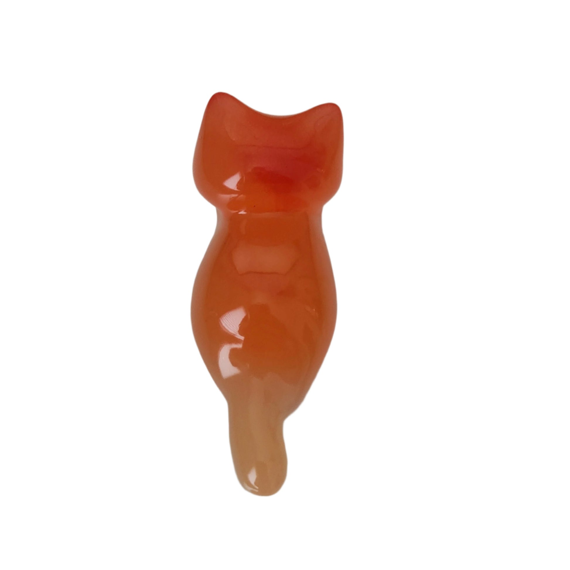 This adorable little orange cat is handcrafted from epoxy resin, giving it a smooth, glass-like finish that's both durable and delightful to hold. Perfect for desk displays, shelf styling, or as a quirky gift for cat lovers, this tiny feline companion measures just 1 x 2.75 inches and weighs less than an ounce—making it easy to tuck into pockets or purses. Each piece showcases the unique character of artisanal resin work, creating a charming trinket that's as fun to look at as it is to collect.
