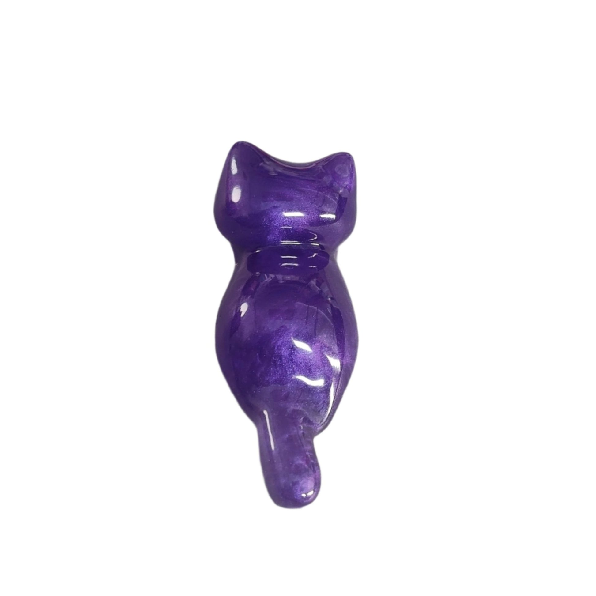 This charming Knickknack features a small purple cat made of resin. Perfect for holding trinkets and adding a touch of feline grace to your home decor!