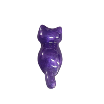 This charming Knickknack features a small purple cat made of resin. Perfect for holding trinkets and adding a touch of feline grace to your home decor!