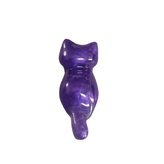 This charming Knickknack features a small purple cat made of resin. Perfect for holding trinkets and adding a touch of feline grace to your home decor!