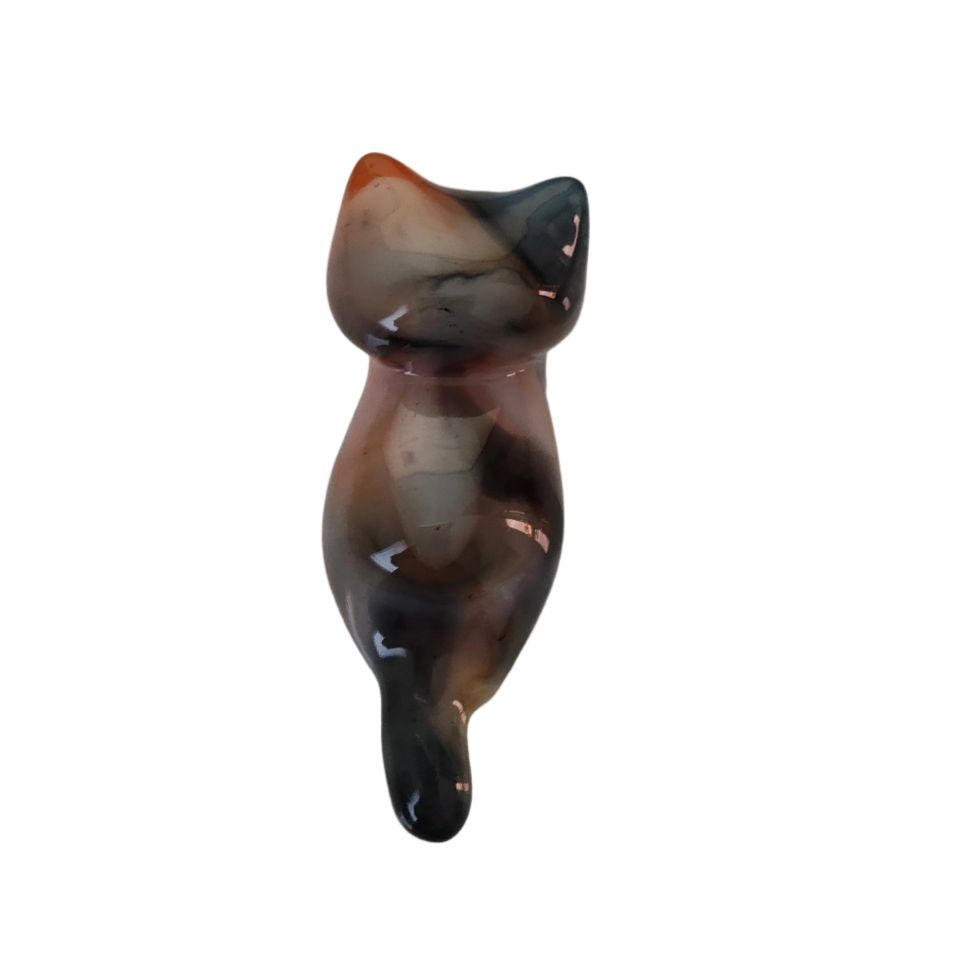 This adorable calico cat trinket is handcrafted from epoxy resin, giving it a smooth, glass-like finish that's both durable and delightfully tactile. Perfect for desk displays, shelf styling, or as a quirky gift for cat lovers, this petite feline measures just 1 x 2.75 inches and weighs a feather-light 0.96 oz. Each piece showcases the artisan charm of handmade resin work, making it a one-of-a-kind accent that brings personality to any space.