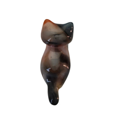 This adorable calico cat trinket is handcrafted from epoxy resin, giving it a smooth, glass-like finish that's both durable and delightfully tactile. Perfect for desk displays, shelf styling, or as a quirky gift for cat lovers, this petite feline measures just 1 x 2.75 inches and weighs a feather-light 0.96 oz. Each piece showcases the artisan charm of handmade resin work, making it a one-of-a-kind accent that brings personality to any space.