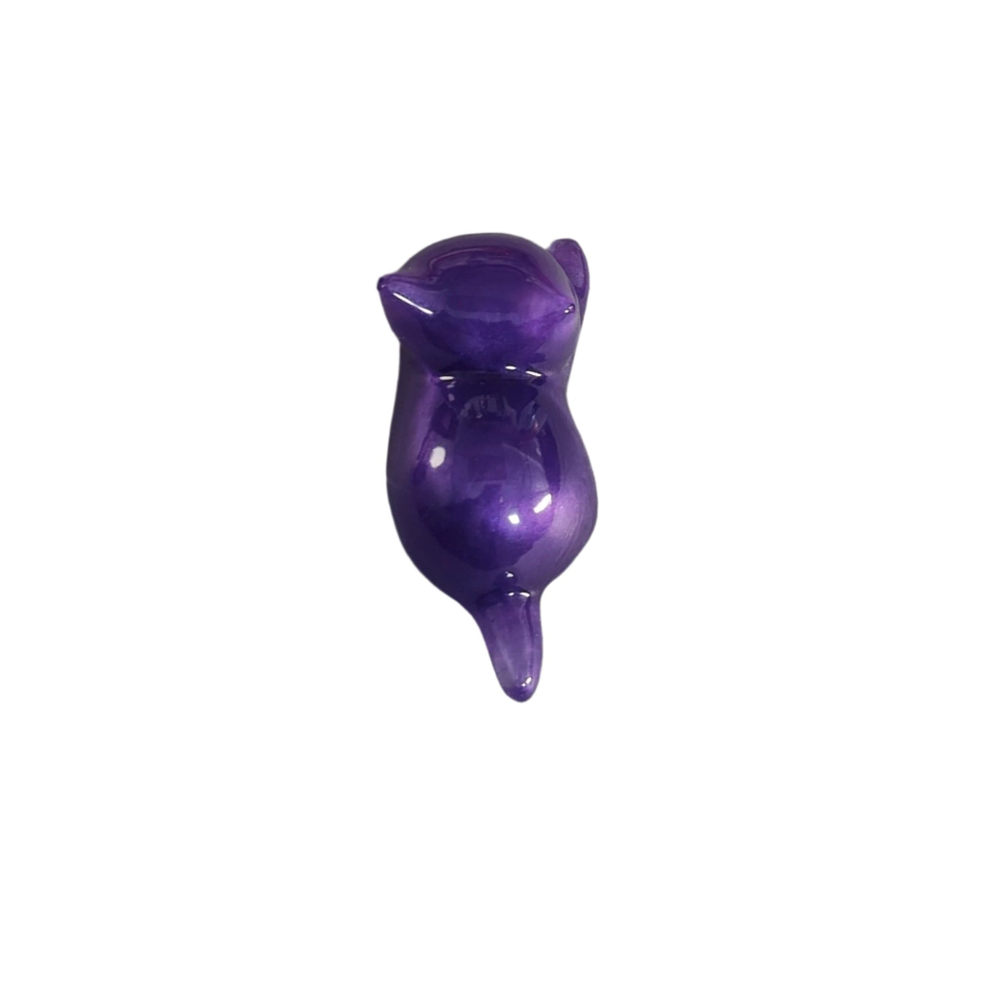 This charming Knickknack features a small purple cat made of resin. Perfect for holding trinkets and adding a touch of feline grace to your home decor!