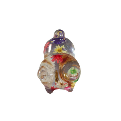 Add some purrfect charm to your home with our playful "Knickknack" resin cat trinket. This small, clear feline is adorned with delicate flowers, making it both stylish and quirky. A unique addition to any knickknack collection.