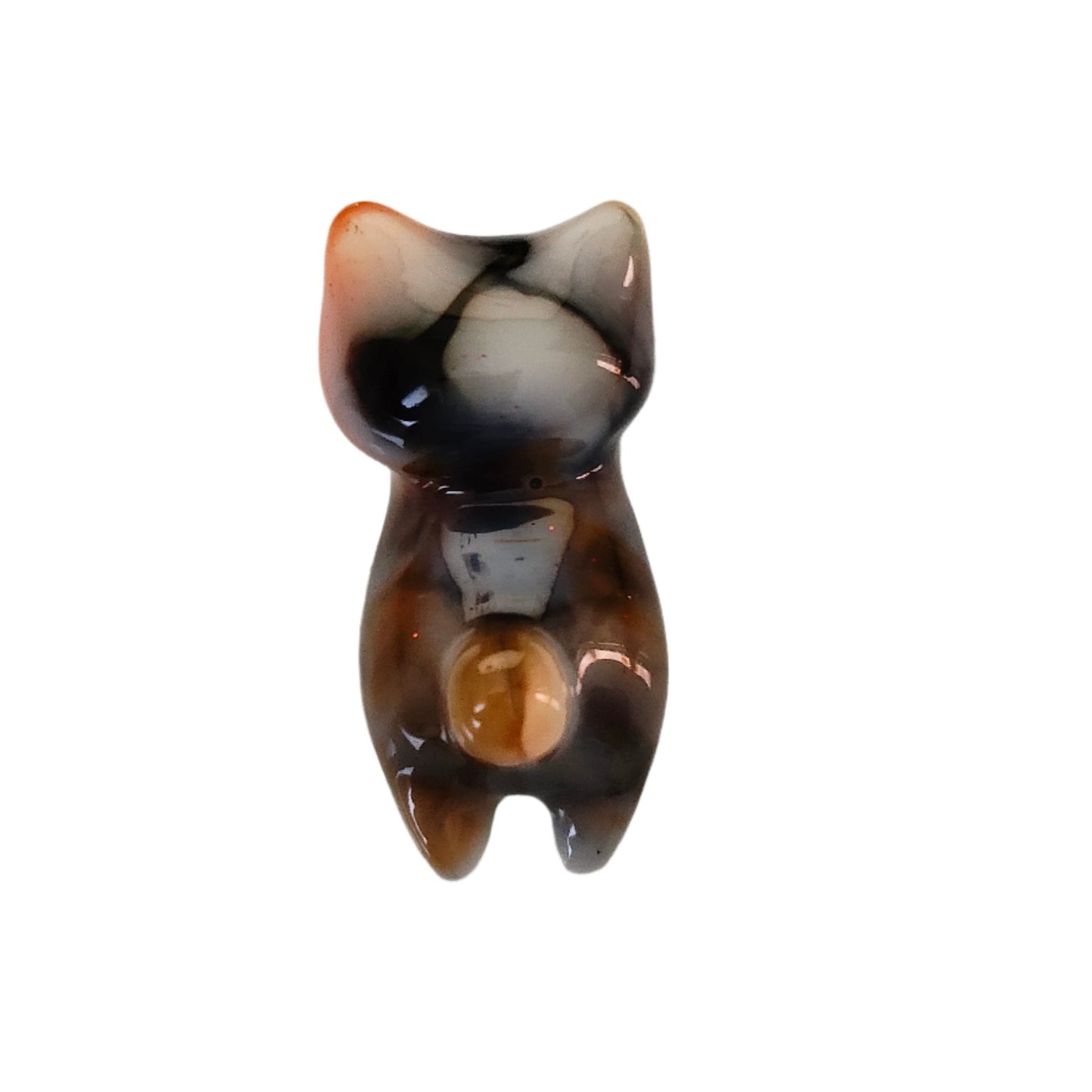 This adorable calico cat trinket is handcrafted from epoxy resin, giving it a smooth, glass-like finish that's both durable and delightfully tactile. Perfect for desk displays, shelf styling, or as a quirky gift for cat lovers, this petite feline measures just 1 x 2.75 inches and weighs a feather-light 0.96 oz. Each piece showcases the artisan charm of handmade resin work, making it a one-of-a-kind accent that brings personality to any space.