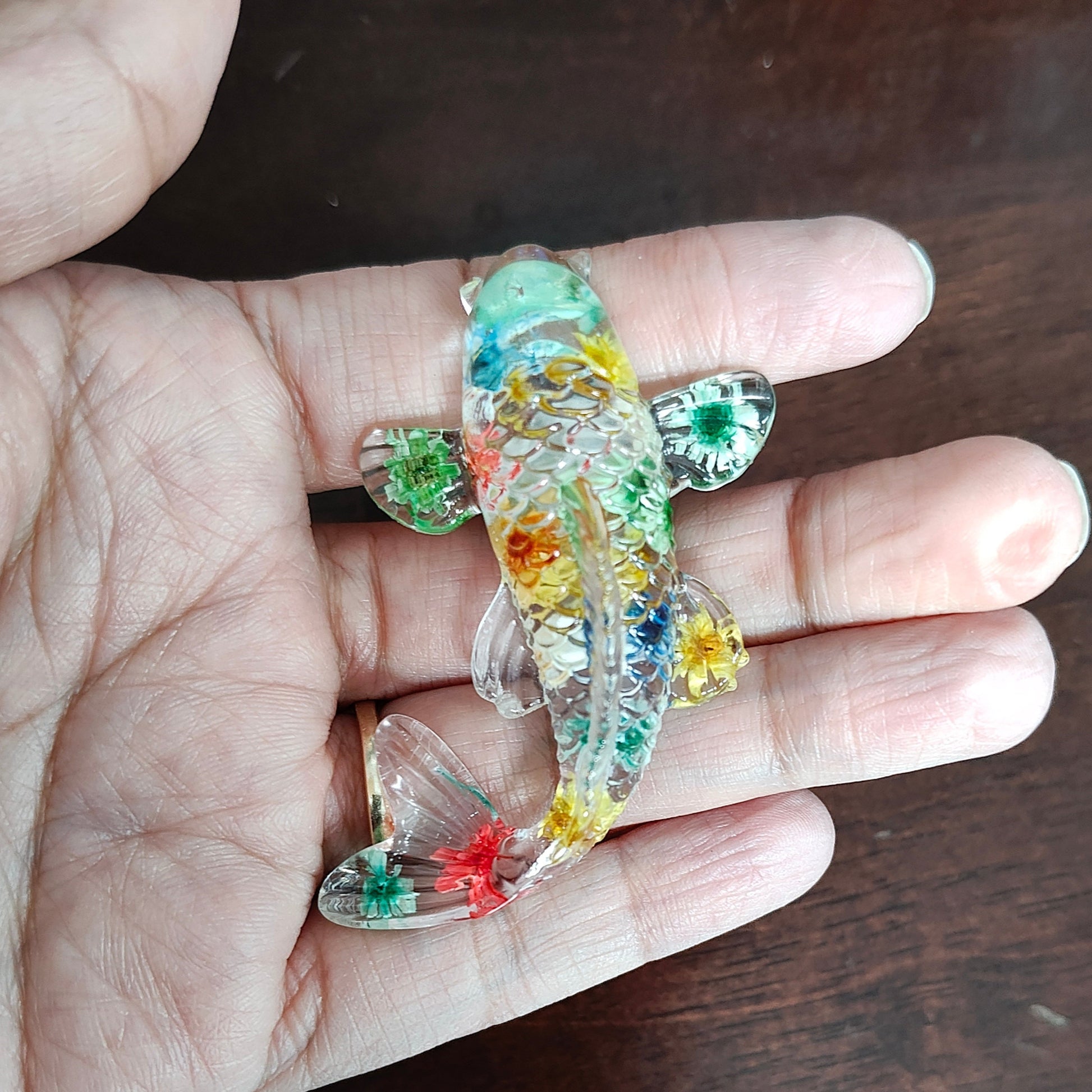 Add a touch of whimsy to any outfit with our 3D fish resin pin! Made with high-quality materials, the detailed design and silver butterfly clutch make it a durable and fashionable accessory. Perfect for any pin collector or sea-life lover.