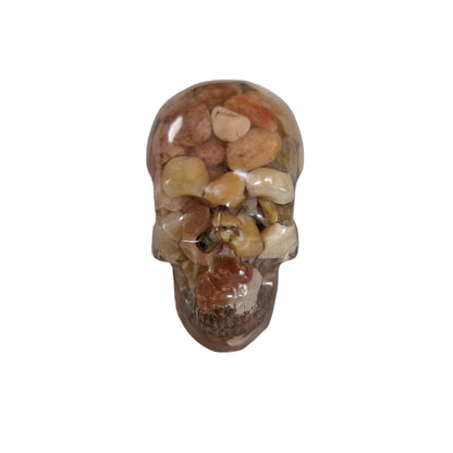 Add a unique touch to your home decor with our Knickknack - Resin small skull. Made with high-quality resin, this skull is a perfect blend of edginess and creativity. Elevate your space with this eye-catching piece that will surely spark your imagination.