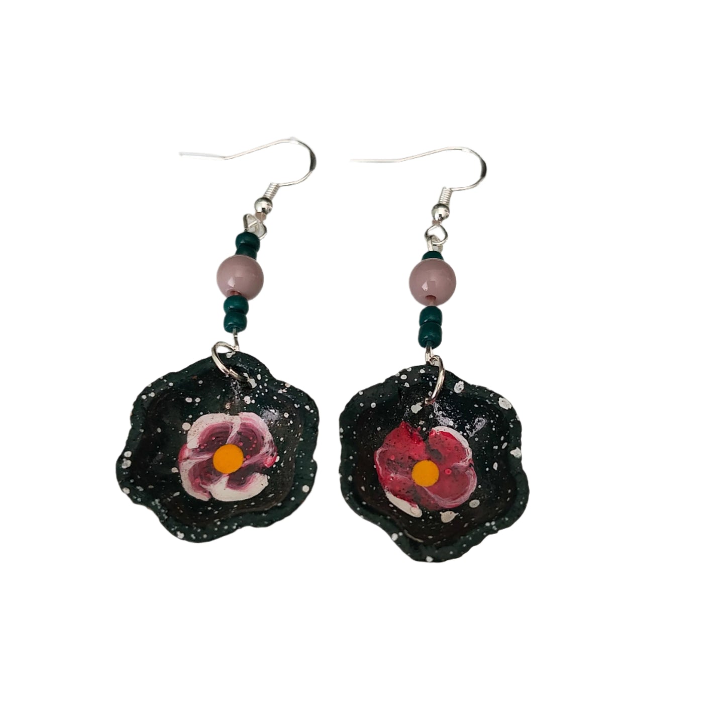 Add a taste of Mexico to your wardrobe with our Earrings! Unique ceramic plates adorned with crystal and seed beads dangle from sleek silver hooks. At 2.5 inches long and weighing only 0.13 oz, these earrings are a lightweight and stylish addition to any outfit.
