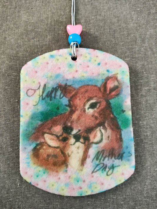 Celebrate Mother's Day with our beautiful Car Ornament! Featuring a double sided design. Perfect for adding a touch of love and appreciation to any car. Show your mom you care and make every drive a happy one!