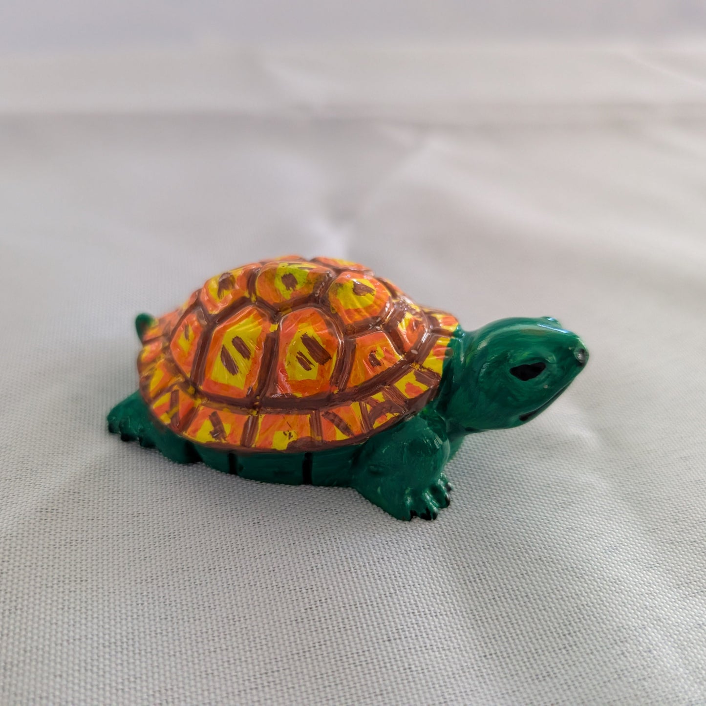 hand crafted with eco resin, and hand painted with acrylic paints.

Eco Resin feels similar to Ceramic or porcelain: smooth, cool to the touch, and non-plastic.