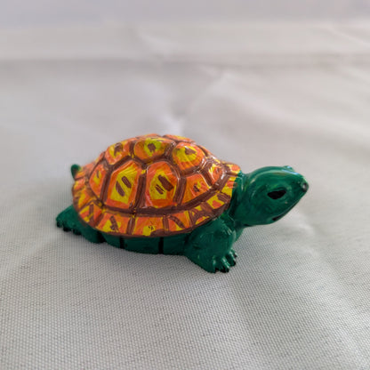 hand crafted with eco resin, and hand painted with acrylic paints.

Eco Resin feels similar to Ceramic or porcelain: smooth, cool to the touch, and non-plastic.