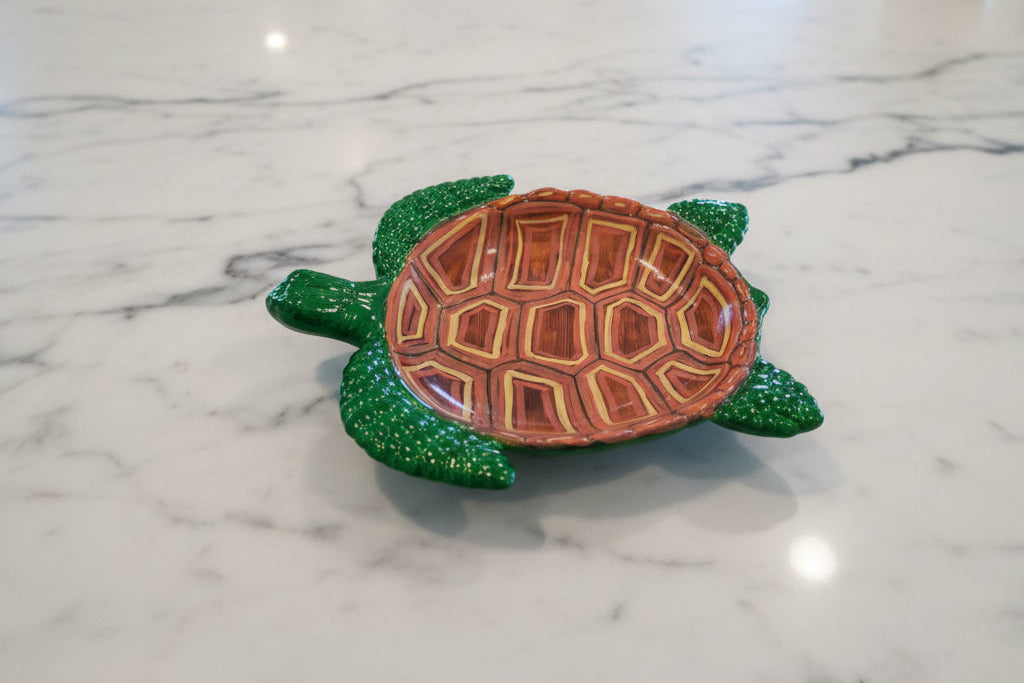 Resin Sea Turtle Tray

hand crafted with eco resin, and hand painted with acrylic paints.

Eco Resin feels similar to Ceramic or porcelain: smooth, cool to the touch, and non-plastic.
