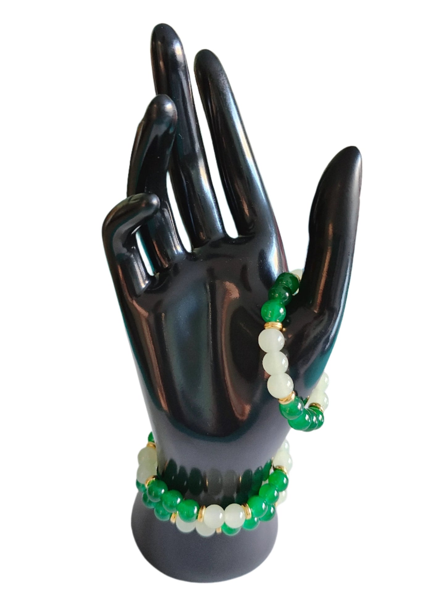 Elevate your style with our stunning elastic bracelet, featuring green and white 8mm glass beads and luxurious gold metal spacer beads. Effortlessly add a touch of elegance to any outfit while enjoying the comfort and convenience of an elastic band. Perfect for any occasion, this bracelet is a must-have for any fashion-forward individual!