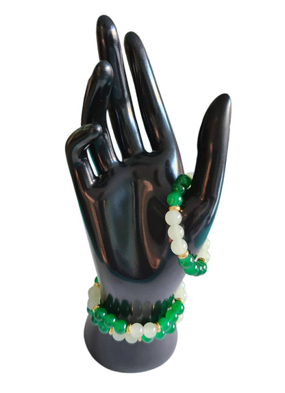 Elevate your style with our stunning elastic bracelet, featuring green and white 8mm glass beads and luxurious gold metal spacer beads. Effortlessly add a touch of elegance to any outfit while enjoying the comfort and convenience of an elastic band. Perfect for any occasion, this bracelet is a must-have for any fashion-forward individual!