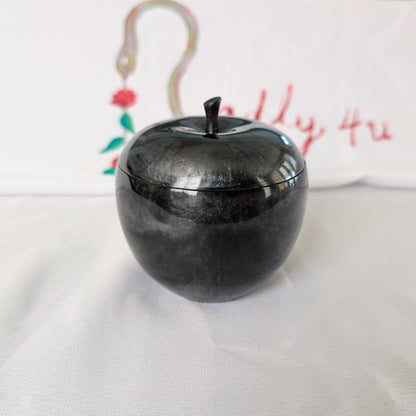 hand crafted with epoxy resin..

Epoxy resin is typically smooth, rigid, and non-porous, similar to a hard plastic or glass.

Knickknack - Resin apple trinket with lid