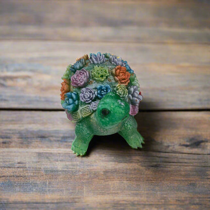 Add a touch of whimsy to your home decor with this adorable Knickknack - Resin Turtle with flowers. Measuring at a perfect 2.25 x 3 inches and weighing just 3 oz, this little guy will fit perfectly on any shelf or desk. His charming design and vibrant flowers will surely put a smile on your face.