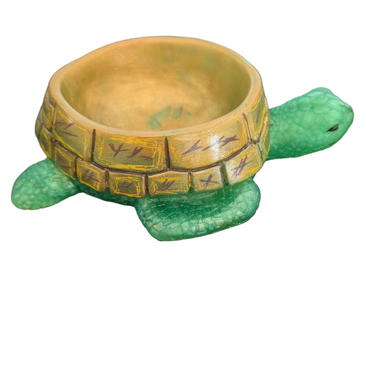 Knickknack - Resin Sea Turtle trinket/pot holder

hand crafted with epoxy resin, and hand painted with acrylic paints.

Epoxy resin is typically smooth, rigid, and non-porous, similar to a hard plastic or glass.