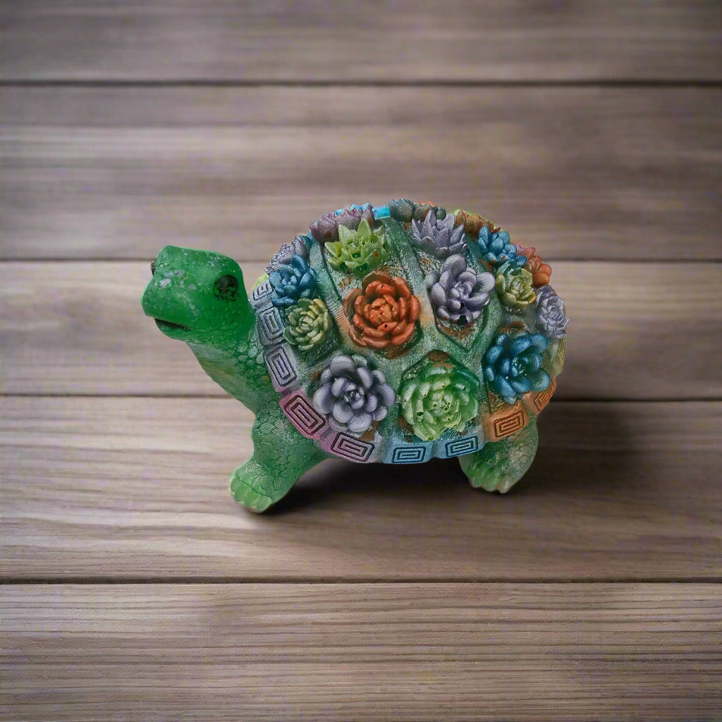 Add a touch of whimsy to your home decor with this adorable Knickknack - Resin Turtle with flowers. Measuring at a perfect 2.25 x 3 inches and weighing just 3 oz, this little guy will fit perfectly on any shelf or desk. His charming design and vibrant flowers will surely put a smile on your face.