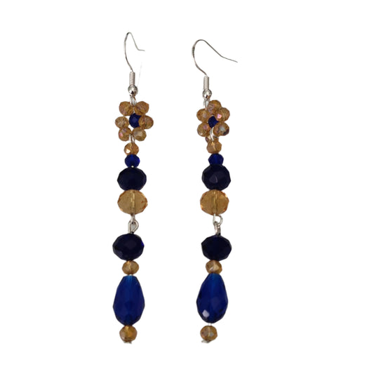 Add a touch of elegance to your outfit with these stunning earrings! The flower gold and navy long bead earrings on silver hook feature crystal beads that will catch the light and sparkle. With a length of approximately 3 inches and weighing only 0.23 oz, they are lightweight and comfortable for all-day wear. Elevate your style with these beautiful earrings now!
