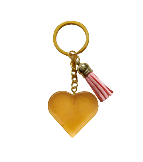 Show your heart is in the right place with this one-of-a-kind keychain! Its resin heart design is as unique as it is eye-catching – no two are alike. Plus, it's lightweight, making it perfect for carrying everywhere you go. Get your keychain on!