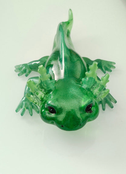 Add a touch of whimsy to your home with our Knickknack - Resin Axolotl! This charming trinket is hand-crafted from resin and features a playful axolotl design. Perfect for adding a pop of personality to any space, it's a must-have for any animal lover.

Knickknack - Resin Axolotl