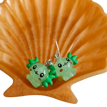 Add a touch of whimsy and charm to any outfit with our adorable Earrings featuring a Resin Axolotl on a delicate hook. These unique earrings are perfect for any animal lover and are sure to spark conversation and bring joy to your day. Stand out from the crowd and embrace your love for cute critters with these fun and stylish accessories!