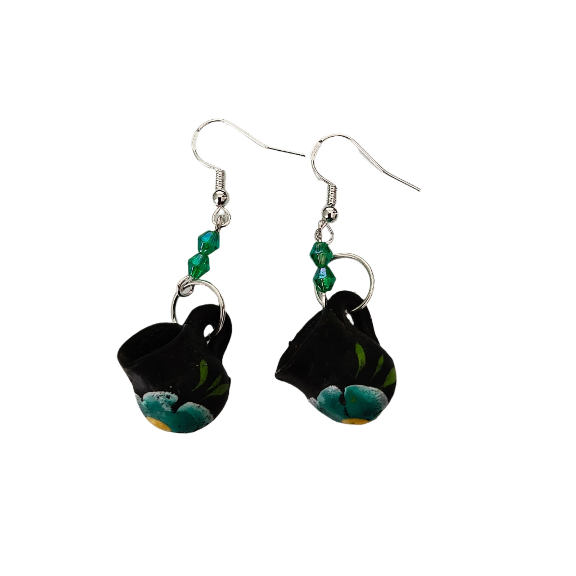 These quirky earrings feature a ceramic Mexican mug with colorful beads hanging from a silver hook. With a length of approximately 2 inches and a weight of only 0.14 oz, they are lightweight and comfortable to wear. Perfect for adding a unique touch to any outfit!
