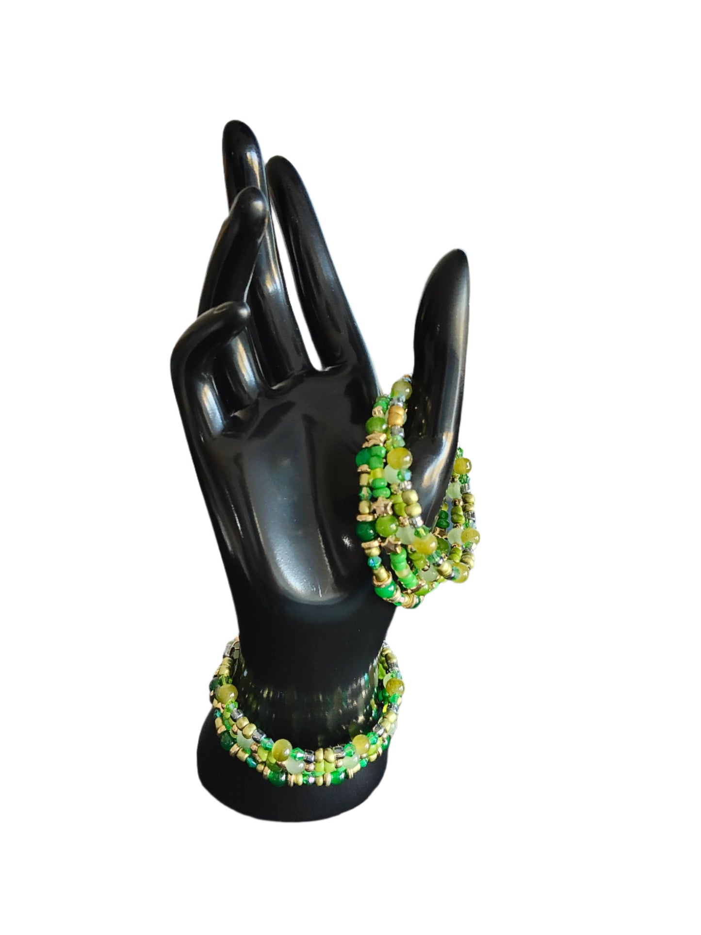 Elevate your style with our stunning Bracelet - a 4 coil piece featuring vibrant 6mm green glass and seed beads, accented with elegant gold spacer beads. The unique memory wire design ensures a perfect fit every time. Make a statement and add a touch of luxury to any outfit!