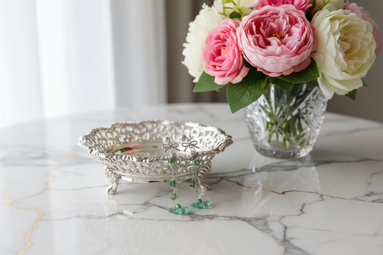 Elevate your everyday style with these enchanting butterfly earrings, featuring delicate silver chains, a charming bow accent, and sparkling crystal beads suspended from classic silver ball post studs. At approximately 3 inches in length, they offer the perfect balance of presence and wearability, making them ideal for both casual outings and special occasions. Weighing just 0.18 oz, these lightweight beauties won't weigh you down, allowing you to wear them comfortably all day long. The intricate design com