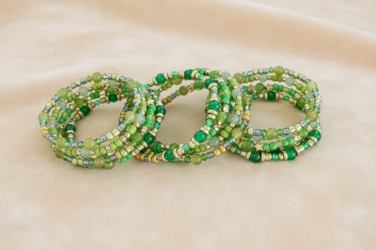 Elevate your style with our stunning Bracelet - a 4 coil piece featuring vibrant 6mm green glass and seed beads, accented with elegant gold spacer beads. The unique memory wire design ensures a perfect fit every time. Make a statement and add a touch of luxury to any outfit!
