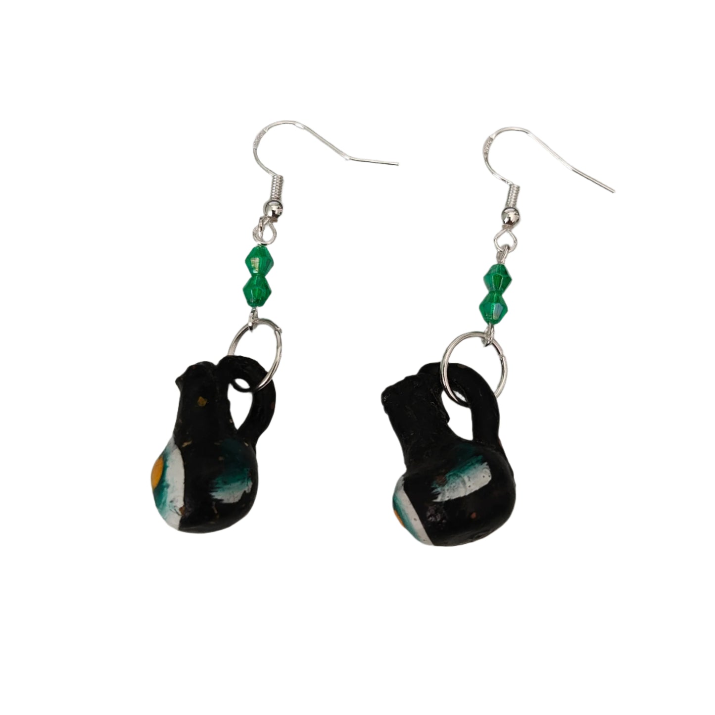 These quirky earrings feature a ceramic Mexican mug with colorful beads hanging from a silver hook. With a length of approximately 2 inches and a weight of only 0.14 oz, they are lightweight and comfortable to wear. Perfect for adding a unique touch to any outfit!