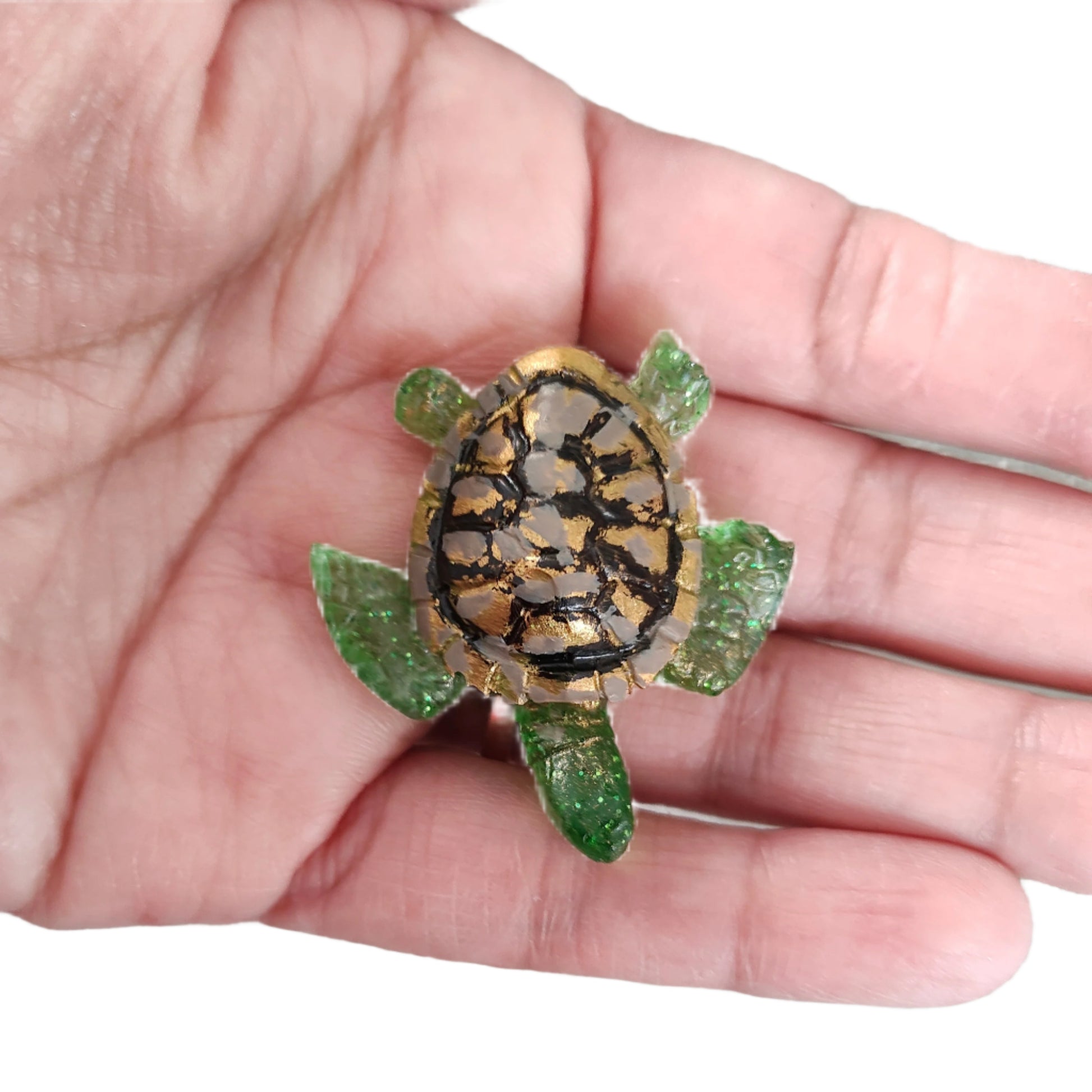 This 3D resin turtle pin is a charming addition to any outfit. The silver butterfly clutch ensures it stays securely in place. Show off your love of turtles with this unique pin!