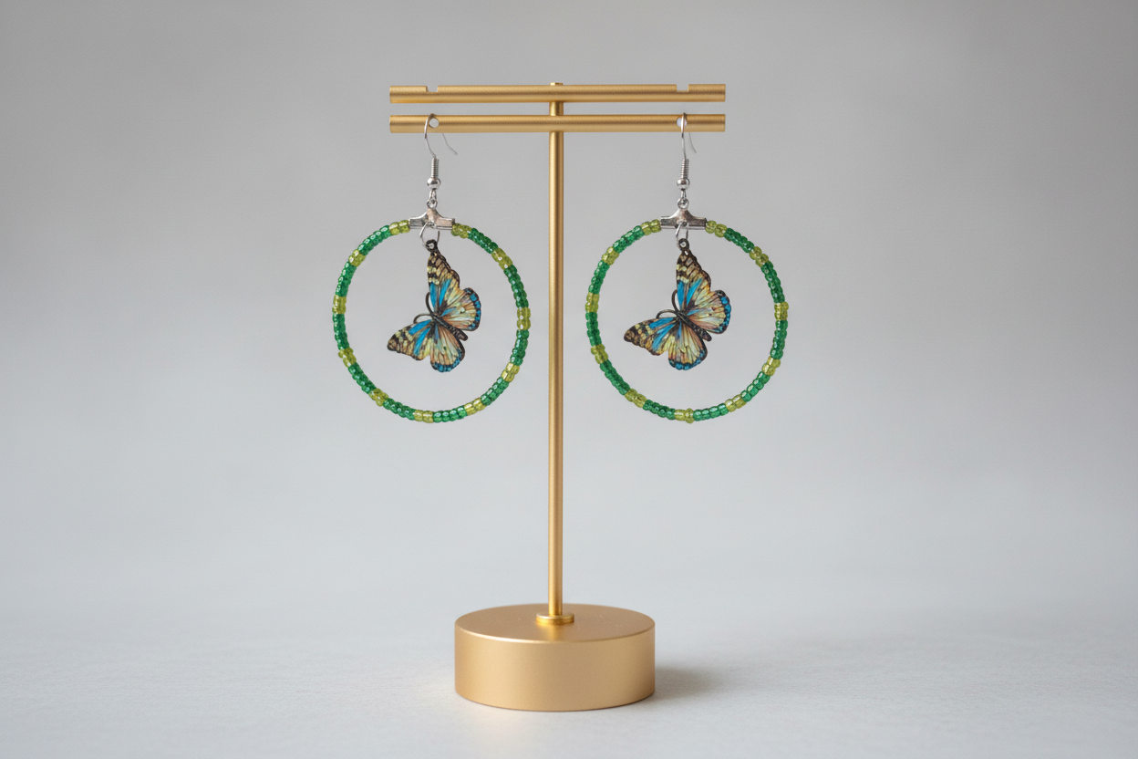 Add a touch of whimsy and elegance to your look with our Silver hoop earrings adorned with delicate seed beads and a beautiful filigree butterfly charm. These versatile earrings can take you from day to night, elevating any outfit with their unique design and stunning details. A must-have for any jewelry collection!