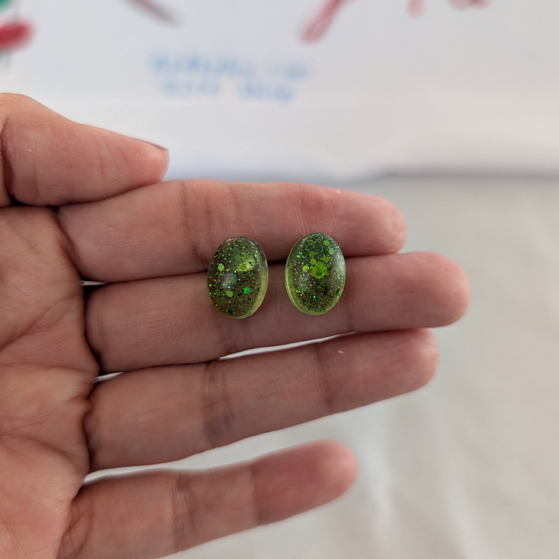 These earrings feature a sleek and modern design, adding a touch of sophistication to your style. Made with high-quality resin, they are lightweight and comfortable to wear all day long.