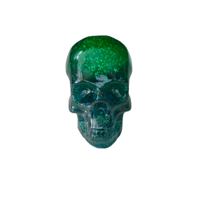 Add a unique touch to your home decor with our Knickknack - Resin small skull. Made with high-quality resin, this skull is a perfect blend of edginess and creativity. Elevate your space with this eye-catching piece that will surely spark your imagination.