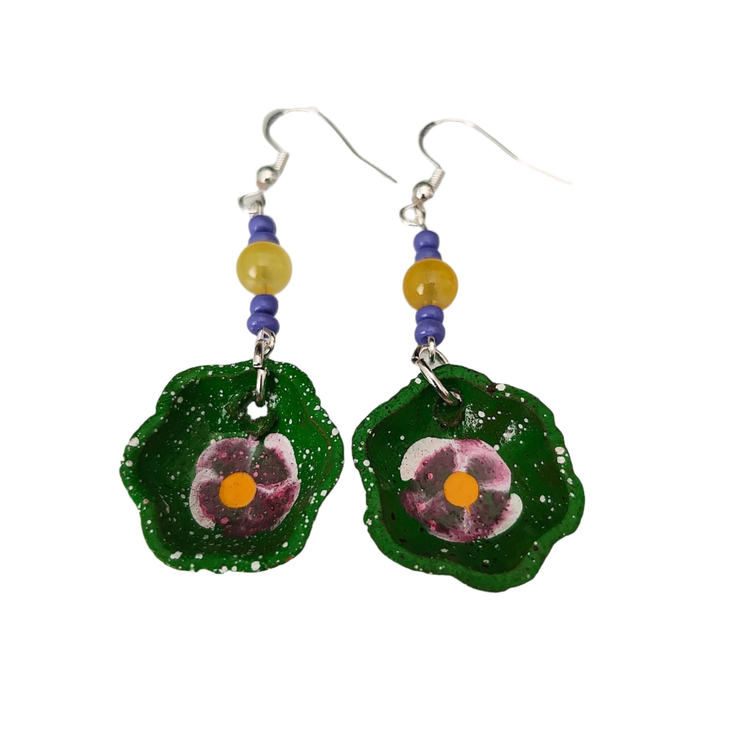 Add a taste of Mexico to your wardrobe with our Earrings! Unique ceramic plates adorned with crystal and seed beads dangle from sleek silver hooks. At 2.5 inches long and weighing only 0.13 oz, these earrings are a lightweight and stylish addition to any outfit.