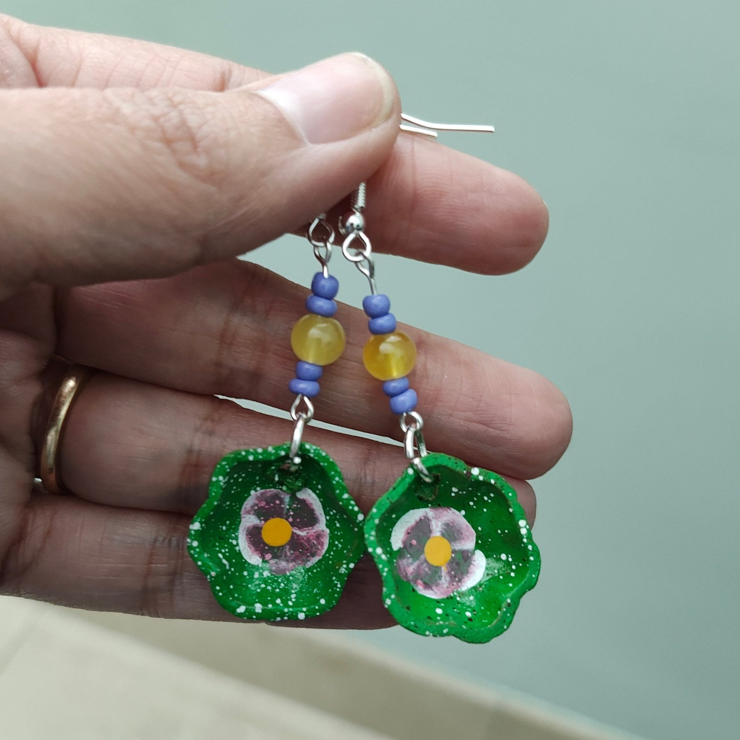 Add a taste of Mexico to your wardrobe with our Earrings! Unique ceramic plates adorned with crystal and seed beads dangle from sleek silver hooks. At 2.5 inches long and weighing only 0.13 oz, these earrings are a lightweight and stylish addition to any outfit.
