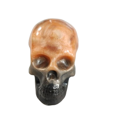 Add a unique touch to your home decor with our Knickknack - Resin small skull. Made with high-quality resin, this skull is a perfect blend of edginess and creativity. Elevate your space with this eye-catching piece that will surely spark your imagination.