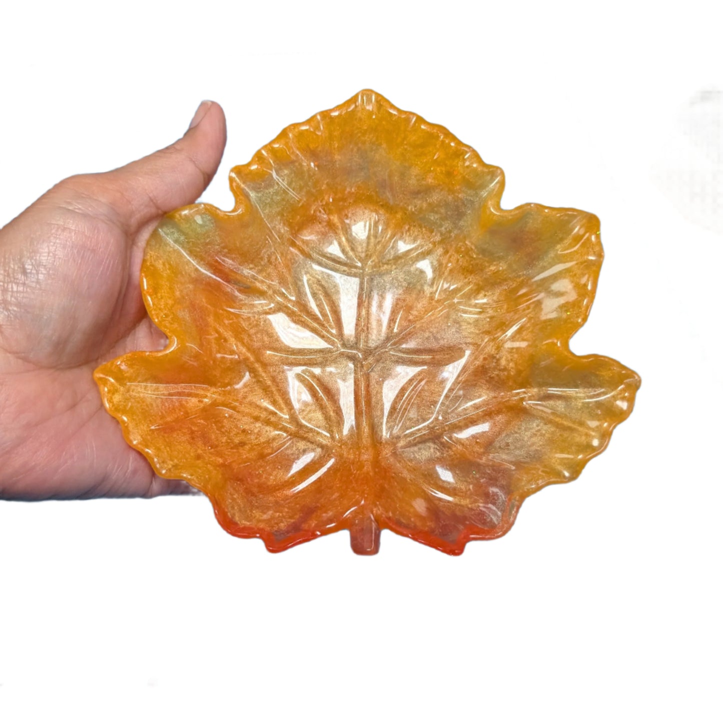 Elevate your space with the Knickknack Resin Maple Leaf Trinket Tray. Crafted with care, its vibrant maple leaf design adds a touch of nature-inspired charm while keeping your small essentials organized. Perfect for keys, jewelry, or coins, this tray combines functionality with seasonal style, making it a must-have accent for any room.