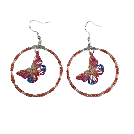 Add a touch of whimsy and elegance to your look with our Silver hoop earrings adorned with delicate seed beads and a beautiful filigree butterfly charm. These versatile earrings can take you from day to night, elevating any outfit with their unique design and stunning details. A must-have for any jewelry collection!