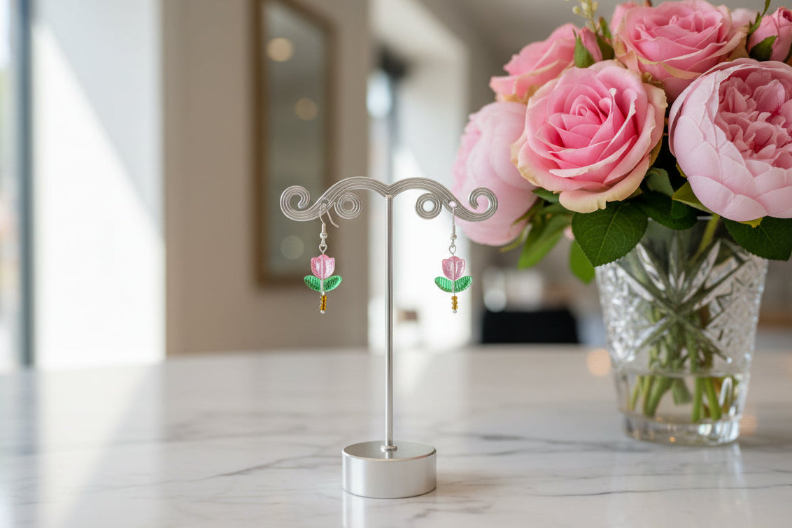 Delicate crystal and seed beads form an enchanting tulip design, suspended from hypoallergenic 925 sterling silver hooks. These lightweight earrings measure just 1.5 inches, making them perfect for everyday elegance or layering with other pieces. At only 0.1 oz, they're comfortable enough to wear all day without fatigue. The shimmering bead work catches light beautifully, adding a touch of sparkle and sophistication to any outfit. Ideal for those who appreciate handcrafted jewelry with timeless appeal.