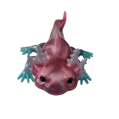 Add a touch of whimsy to your home with our Knickknack - Resin Axolotl! This charming trinket is hand-crafted from resin and features a playful axolotl design. Perfect for adding a pop of personality to any space, it's a must-have for any animal lover.

Knickknack - Resin Axolotl