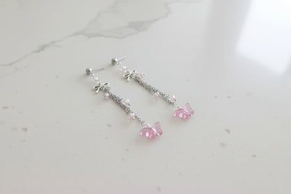 Elevate your everyday style with these enchanting butterfly earrings, featuring delicate silver chains, a charming bow accent, and sparkling crystal beads suspended from classic silver ball post studs. At approximately 3 inches in length, they offer the perfect balance of presence and wearability, making them ideal for both casual outings and special occasions. Weighing just 0.18 oz, these lightweight beauties won't weigh you down, allowing you to wear them comfortably all day long. The intricate design com