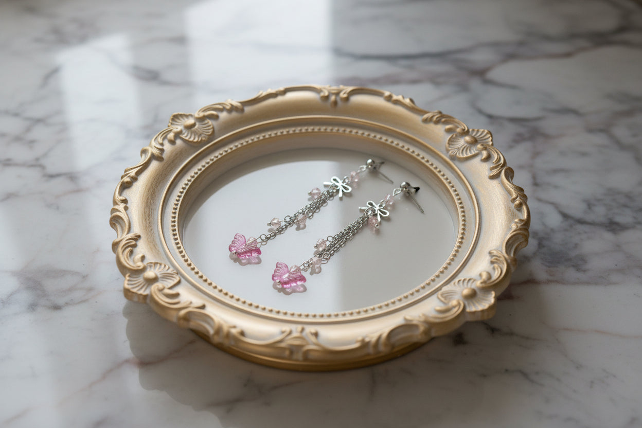 Elevate your everyday style with these enchanting butterfly earrings, featuring delicate silver chains, a charming bow accent, and sparkling crystal beads suspended from classic silver ball post studs. At approximately 3 inches in length, they offer the perfect balance of presence and wearability, making them ideal for both casual outings and special occasions. Weighing just 0.18 oz, these lightweight beauties won't weigh you down, allowing you to wear them comfortably all day long. The intricate design com